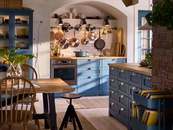 IKEA kitchen with blue cabinets.
